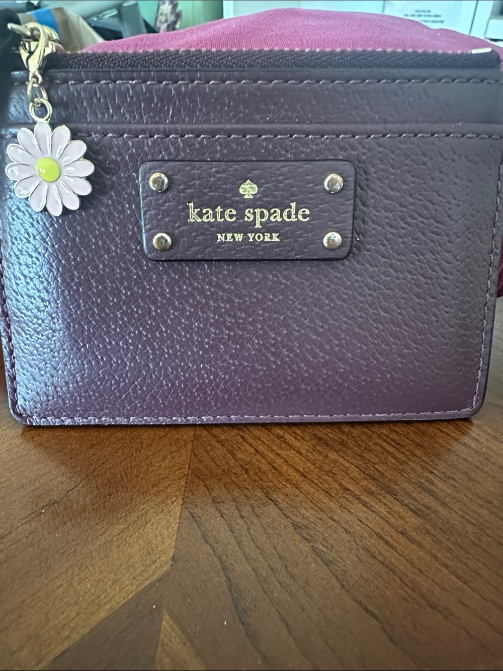 kate spade Plum Leather Card Holder with Pink Daisy Charm with 2 more charms .